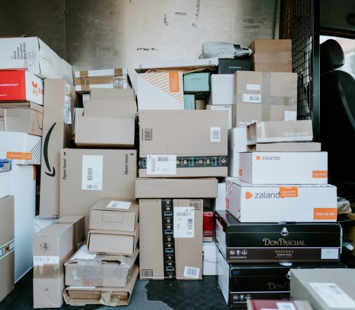 brown cardboard boxes on black plastic crate